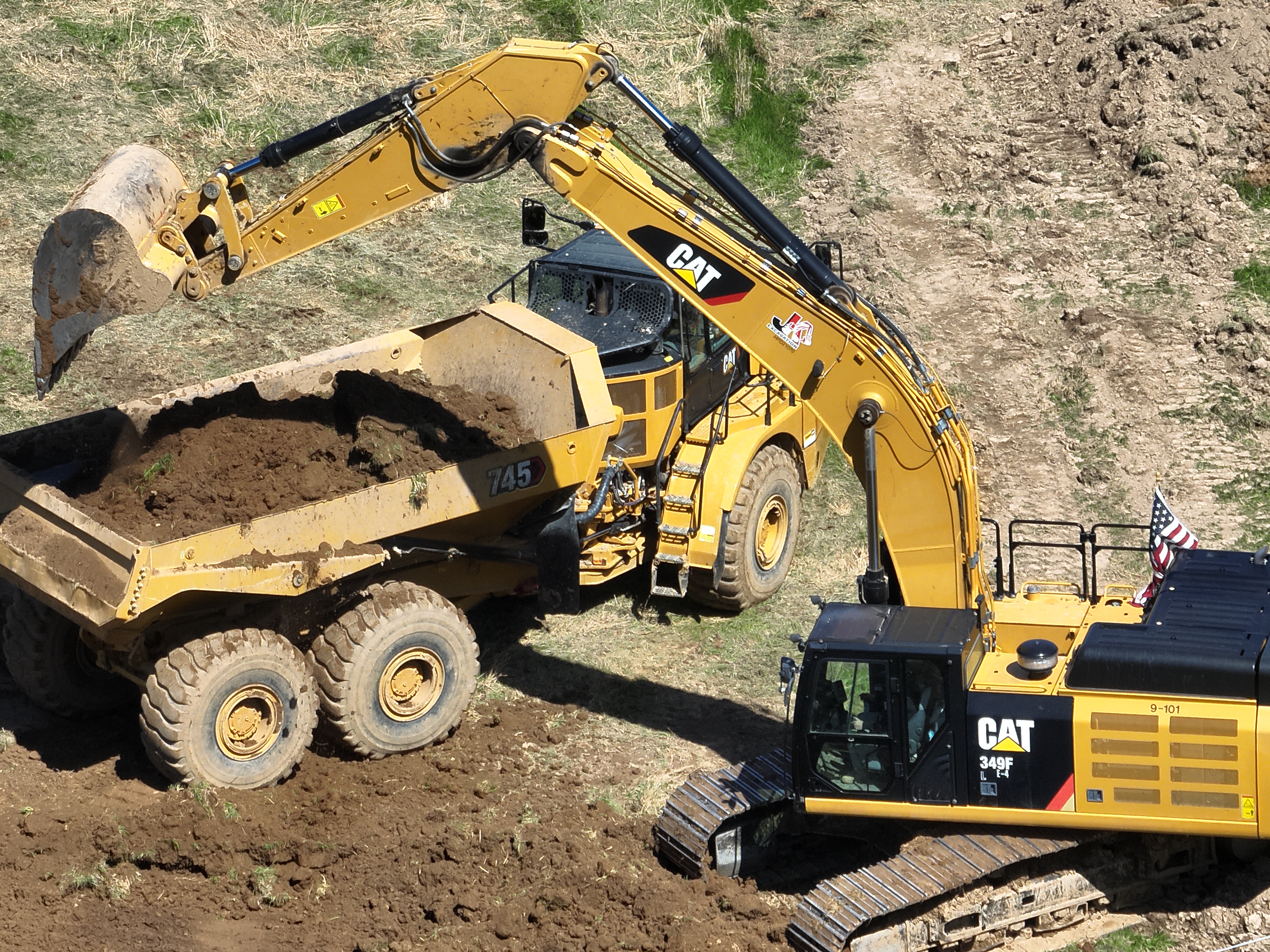 JKE (Josh King Excavation) areial view of project site with company excavator and dump truck in action