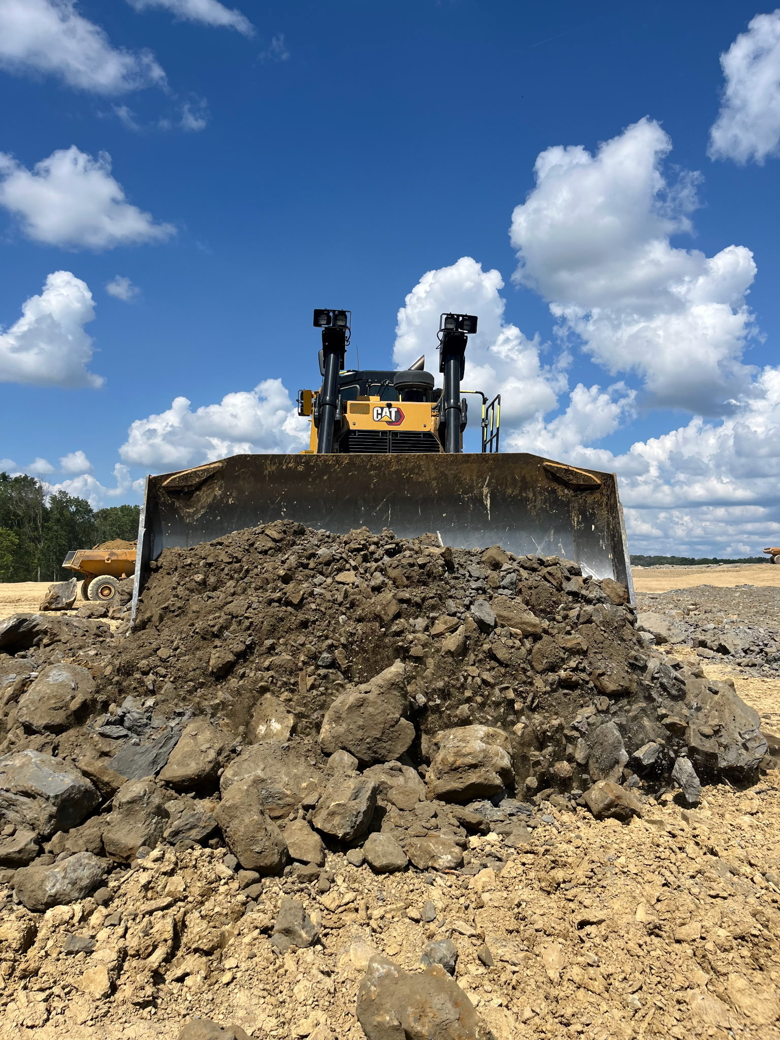 JKE (Josh King Excavation) dozer pushing dirt