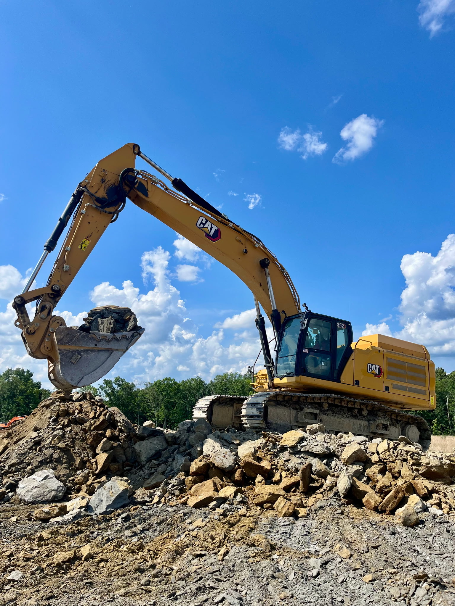 JKE (Josh King Excavation) excavator scouping rocks